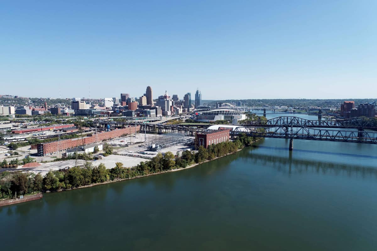 Aerial view of downtown Cincinnati, Ohio across the Ohio River, with Paycor Stadium and the river bridges